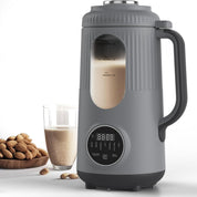 Automatic soy milk maker in charcoal grey shown with a glass of fresh almond milk and raw almonds.