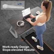 working on a laptop at a standing desk while walking on the Lichico incline treadmill for office productivity.